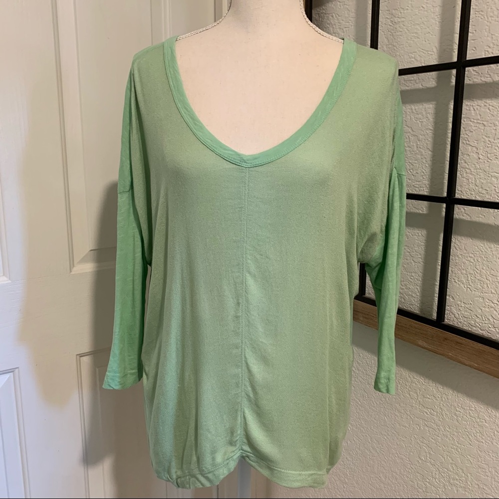 Left of center green top size XS